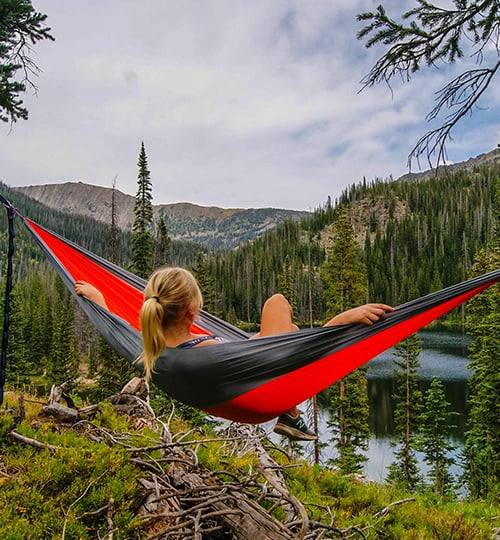 women enjoy solo camping in mountain