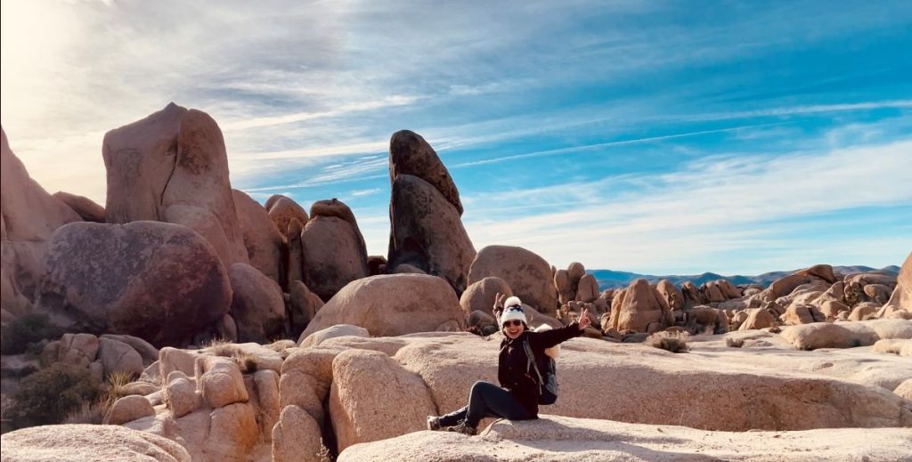 solo women hike arch rock trail in joshua tree